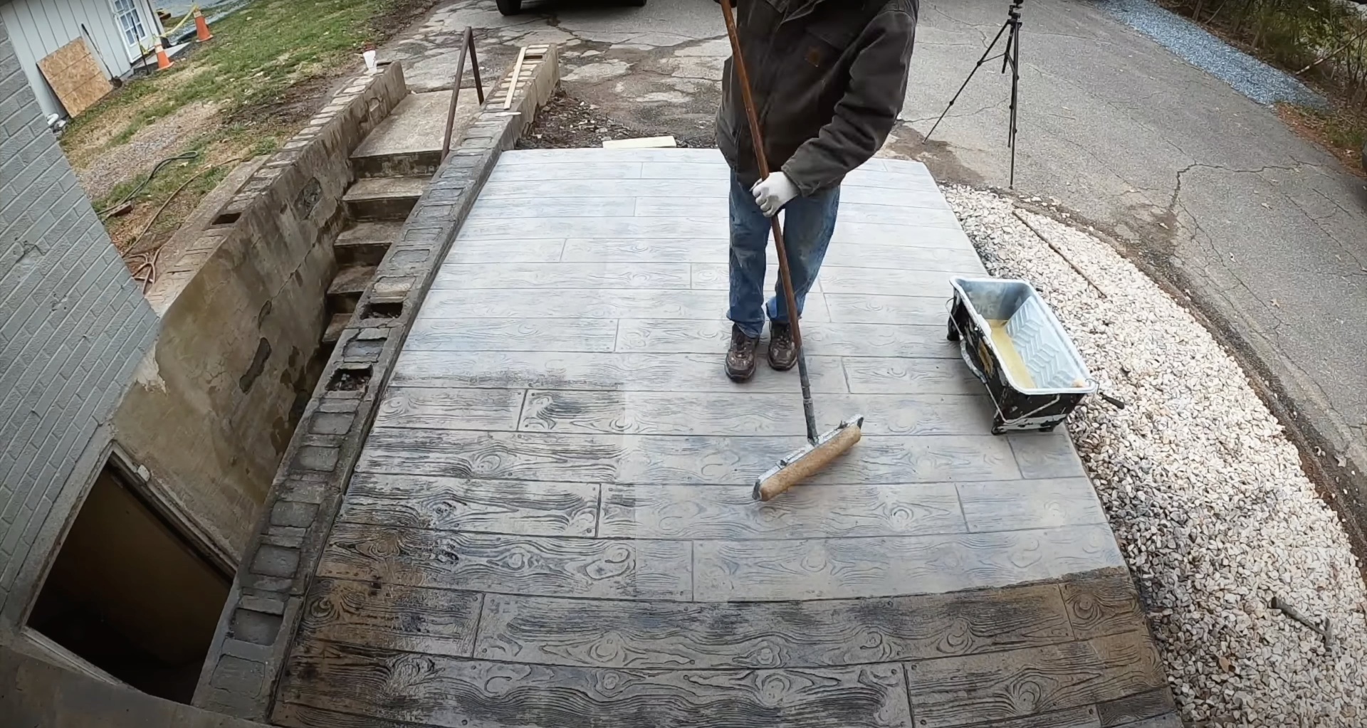 Decorative stamped concrete patio with wood plank design Stamped concrete patio with realistic wood grain pattern and texture